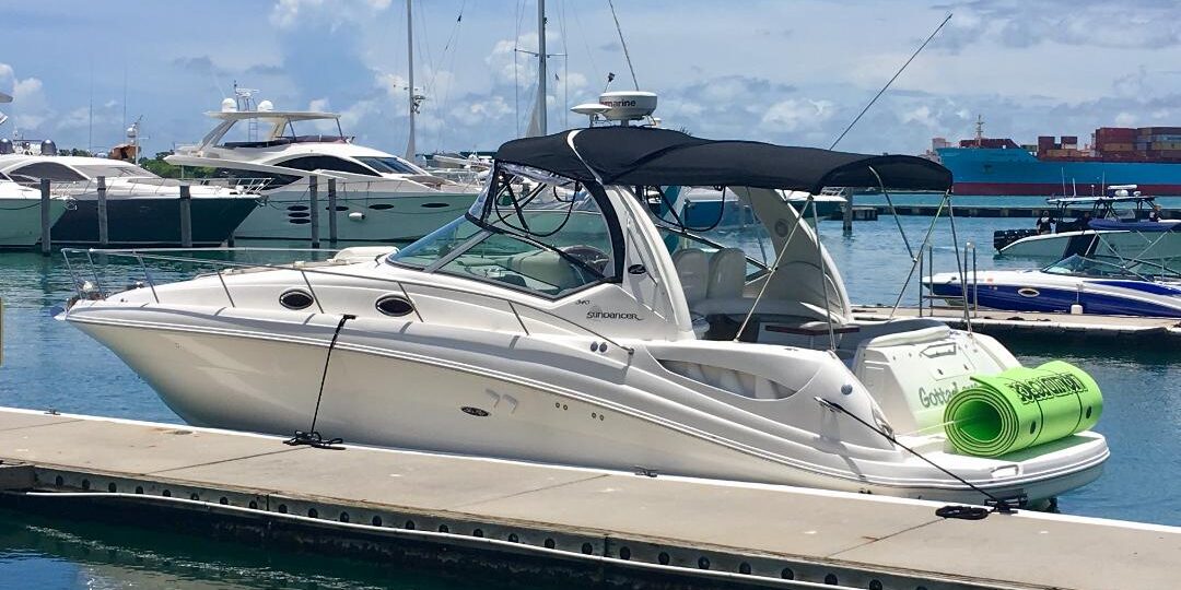 Thirty Seven Feet Sea Ray Sundancer Parked Near The Seashore